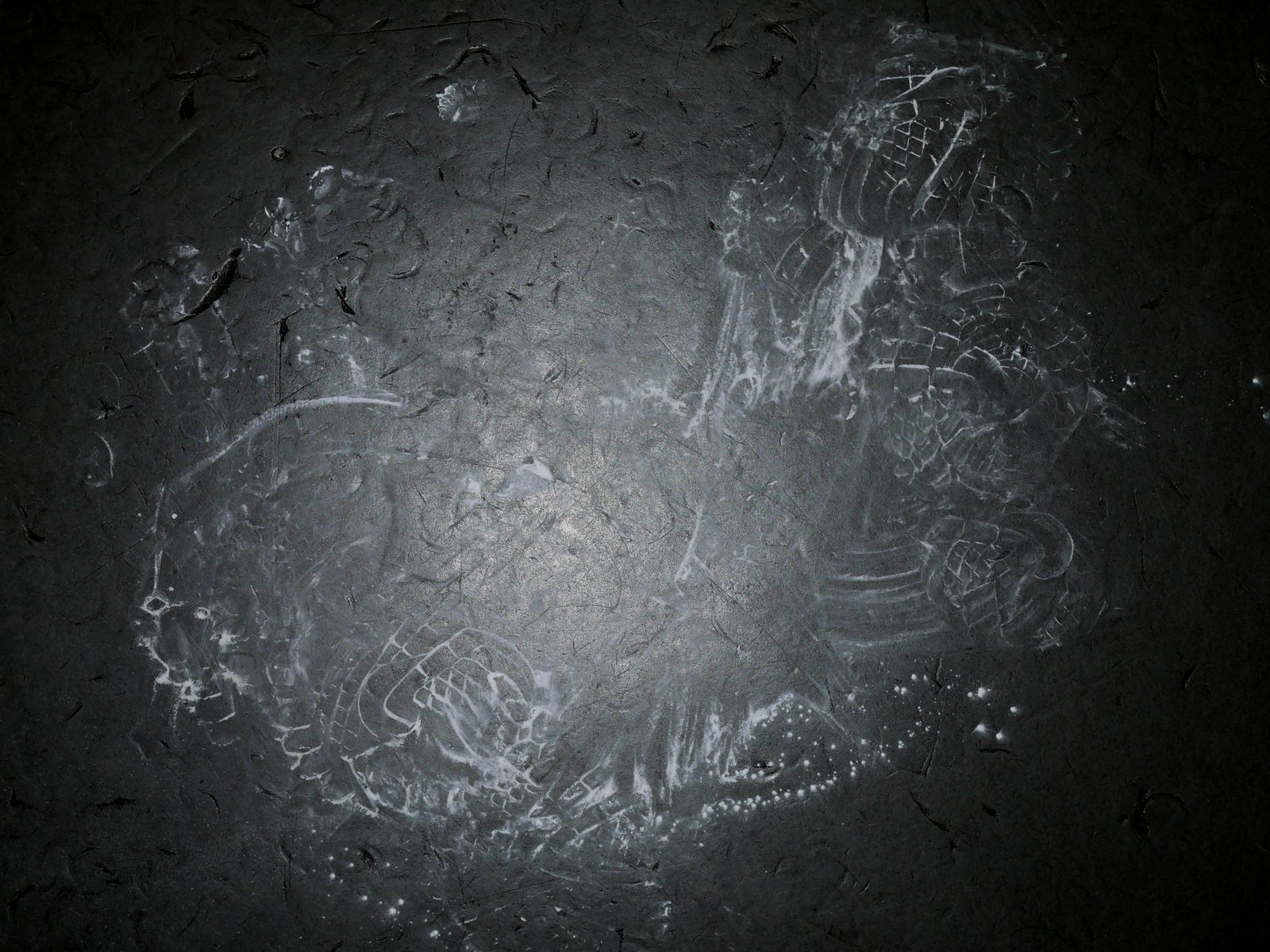 Chalk drawing on a dark floor